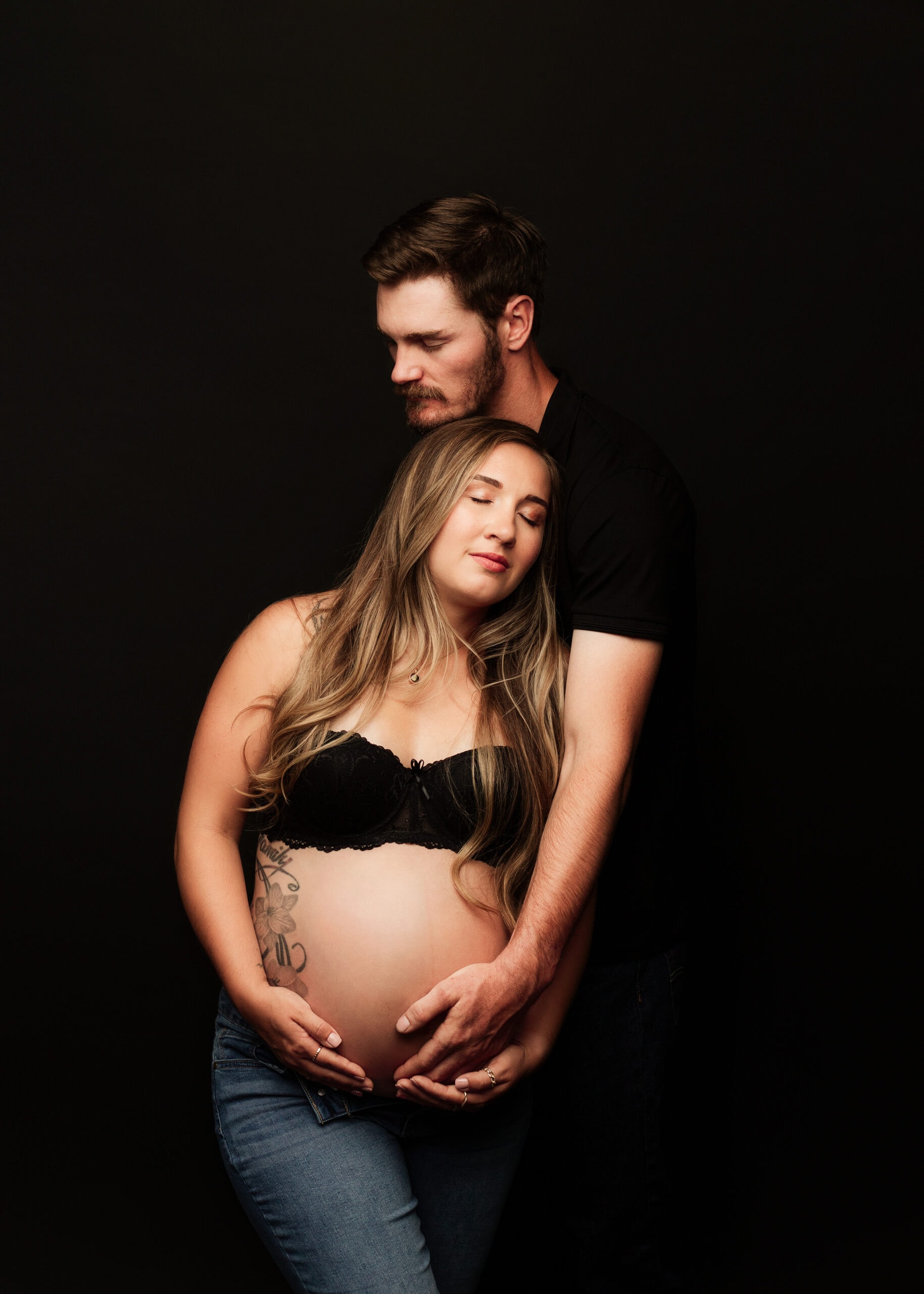 Maternity photograph with spouse in Southern Oregon photography studio.