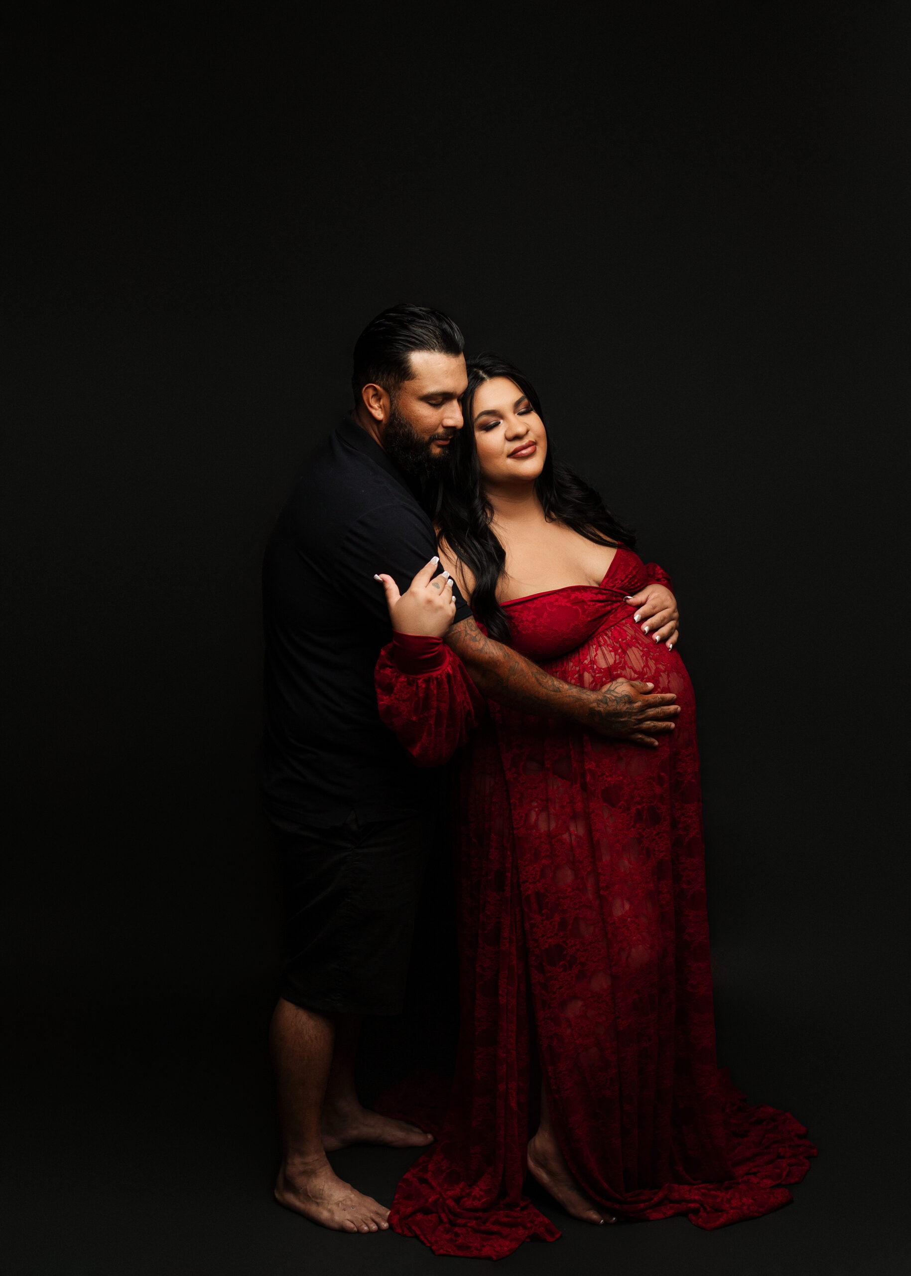 Maternity photograph with spouse in Southern Oregon photography studio.