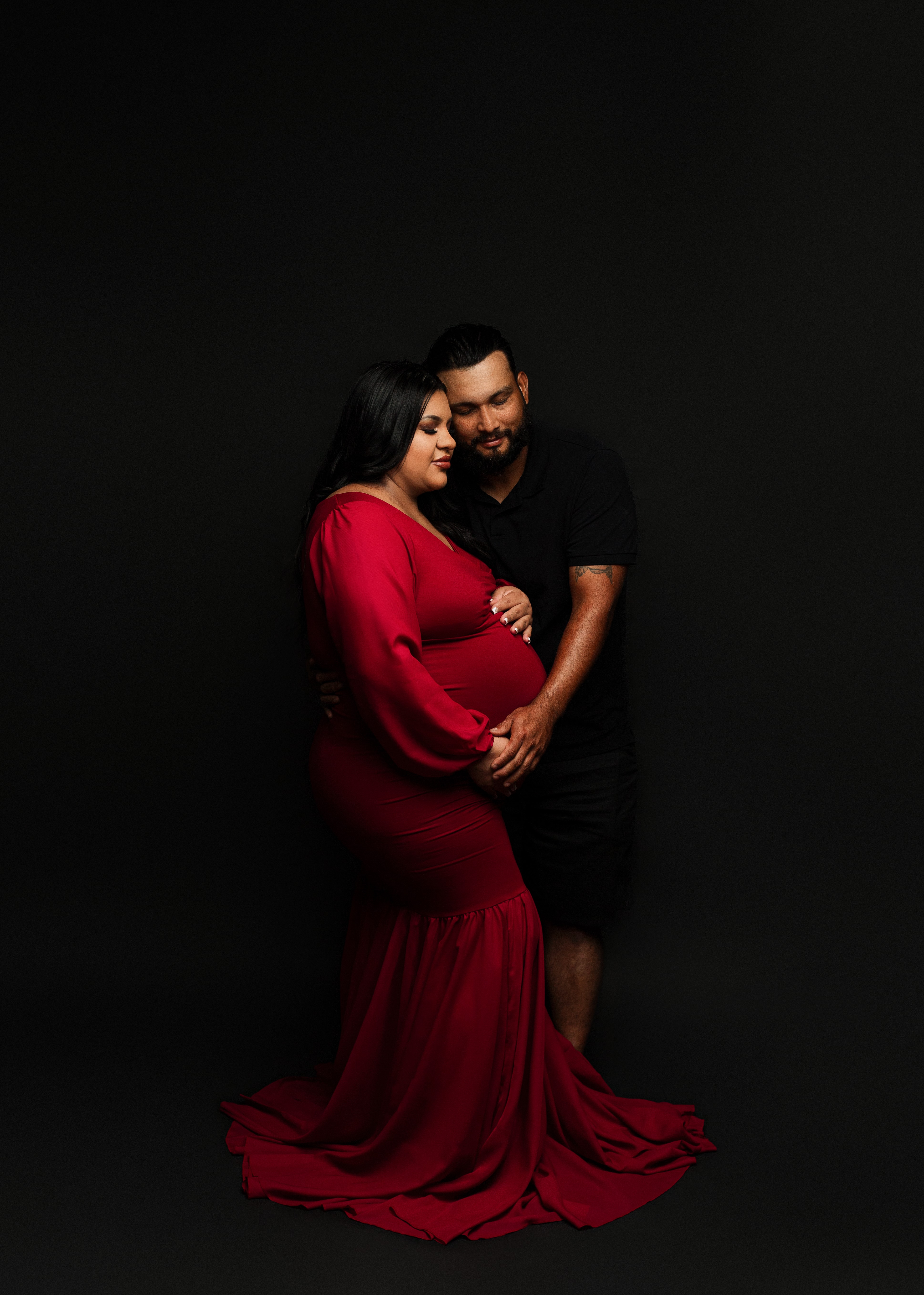 Maternity photograph with spouse in Southern Oregon photography studio.