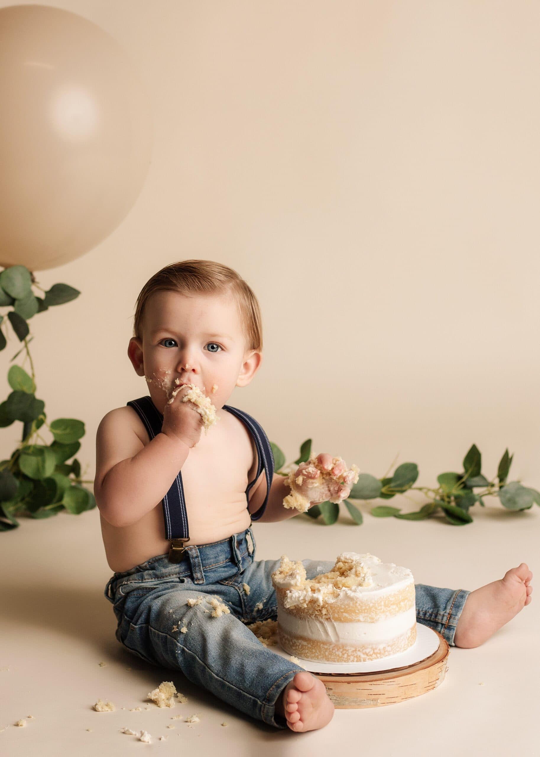 One year old boy cake smash milestone photography session.