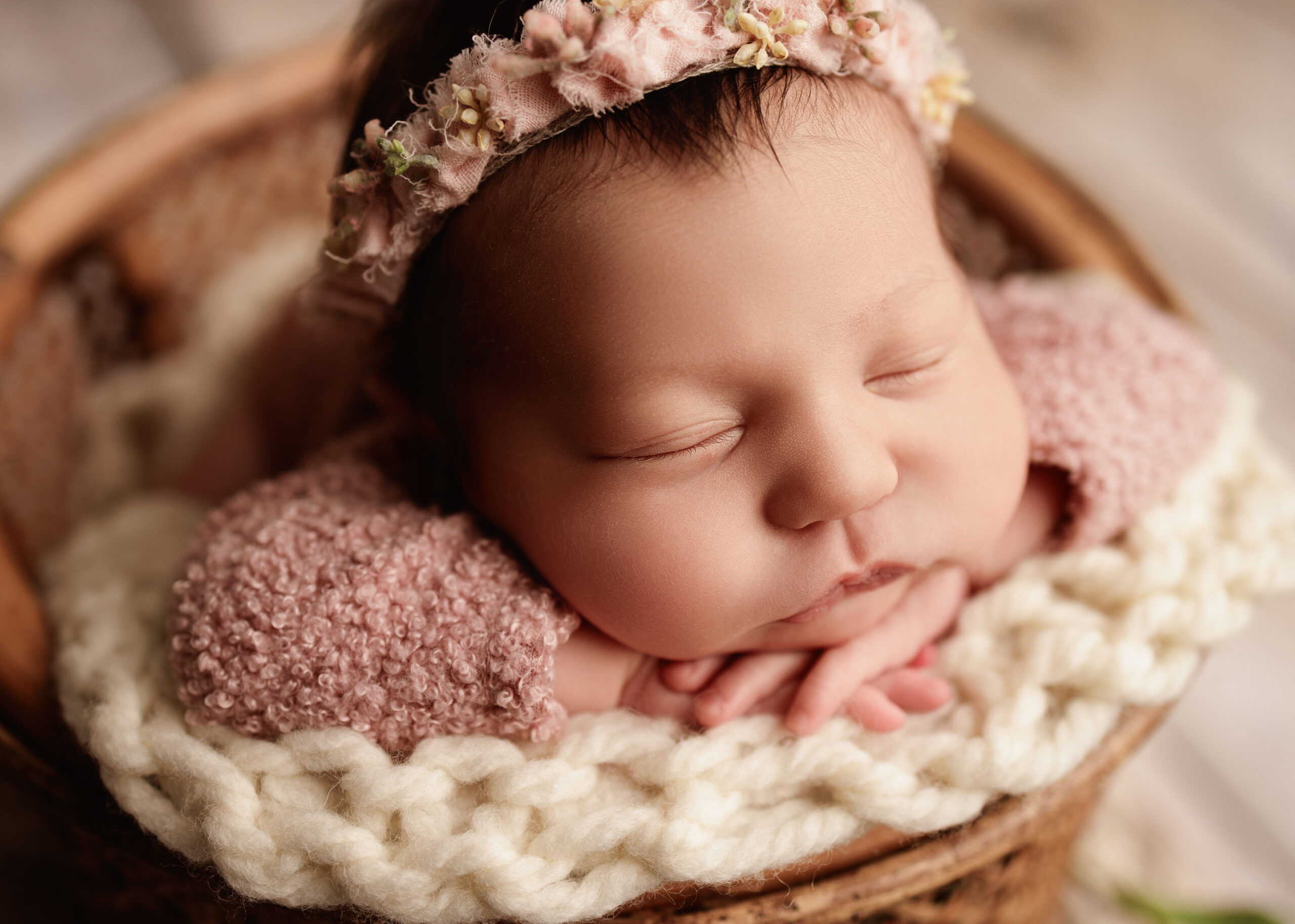 Newborn girl in a prop for a newborn photography photoshoot in Southern Oregon